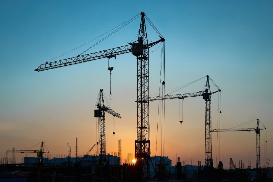 Cranes against night sky